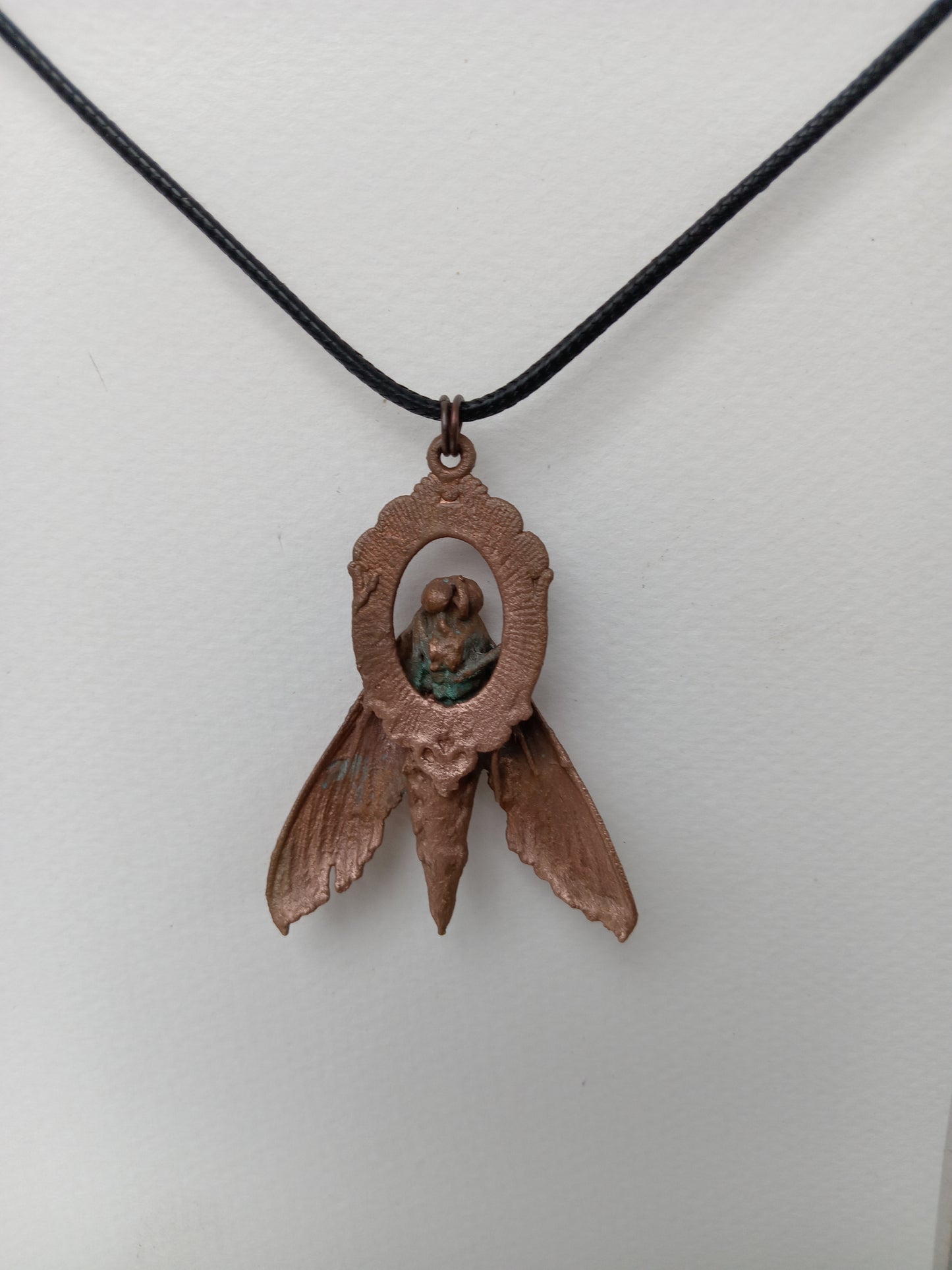 Electroformed copper moth pendant flat lay, slow-made handcrafted jewellery, Obscure Art South Africa