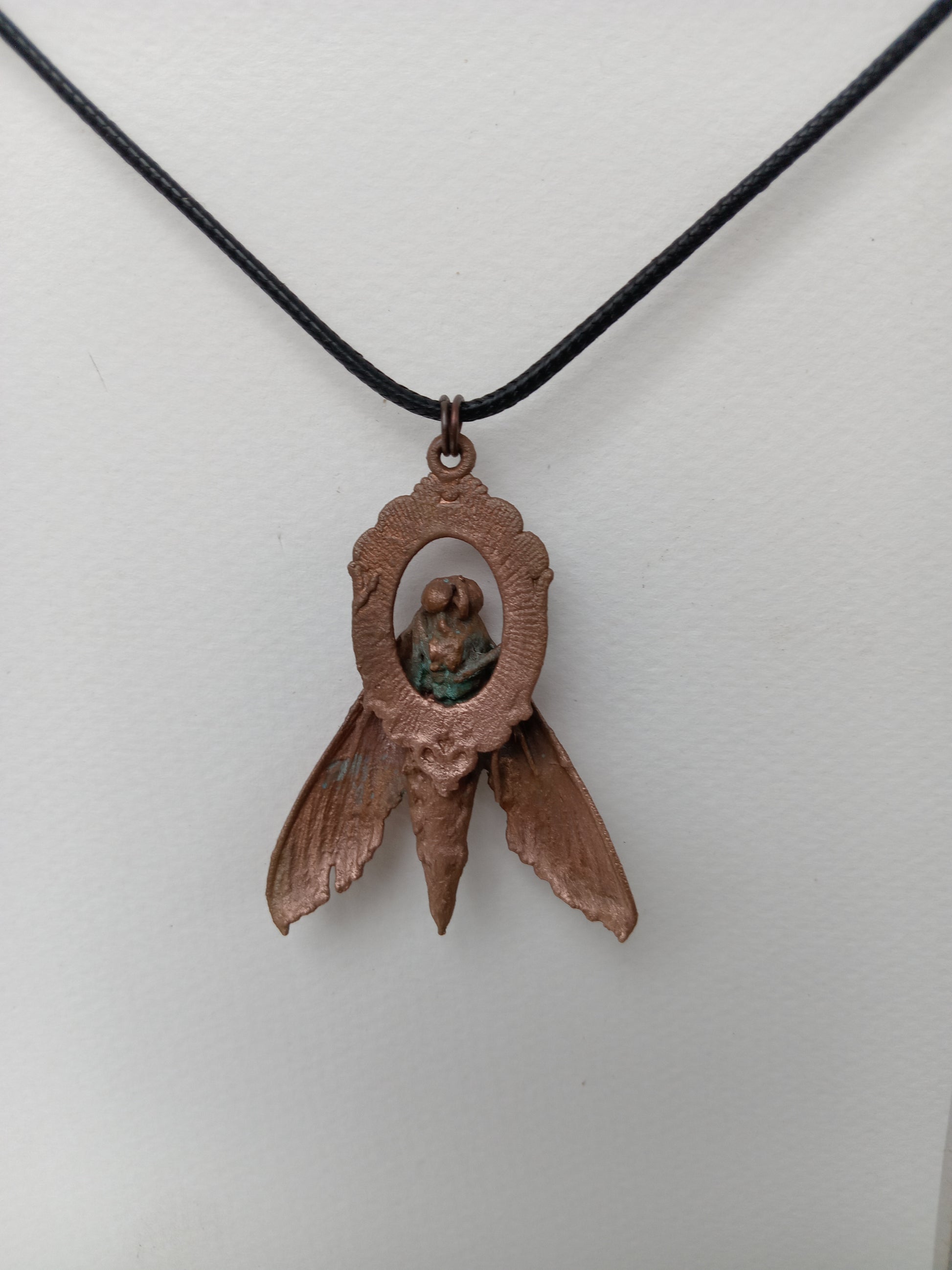 Electroformed copper moth pendant flat lay, slow-made handcrafted jewellery, Obscure Art South Africa